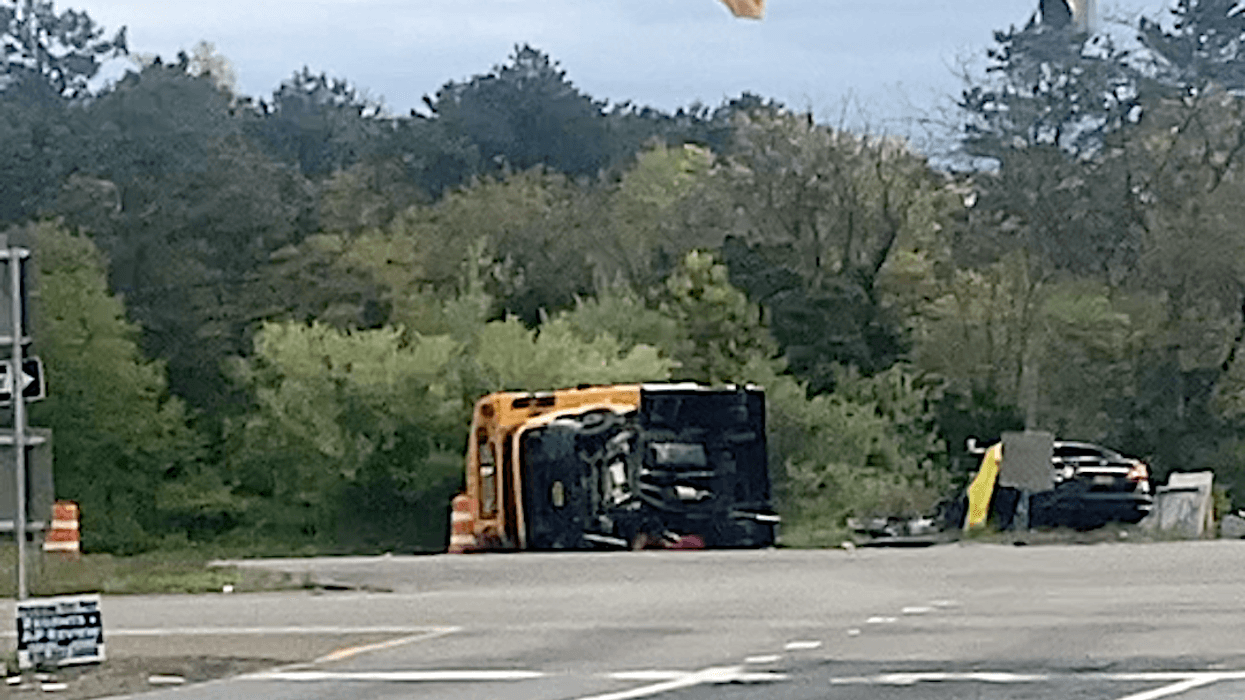 A mini school bus and a black sedan collided in Suffolk County on Thursday morning, killing a mother in her 30s and injuring her baby