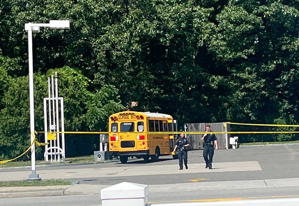 A mini school bus was sideswiped by the truck, but no one on board was seriously injured