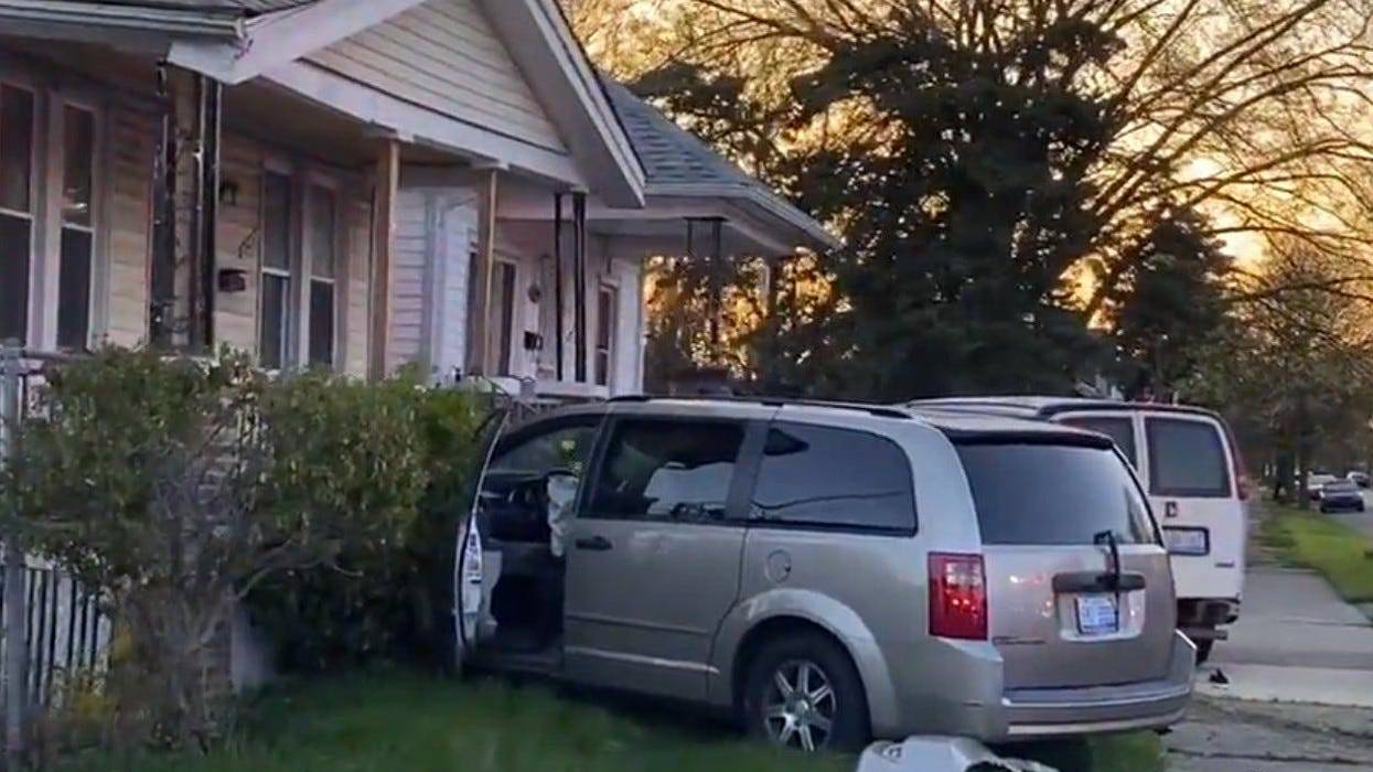 A minivan crashed into the front porch of a house