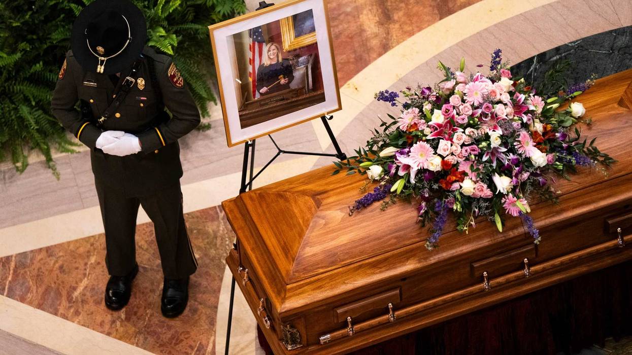 A Minnesota Conservation Officer stands guard as DFL Rep. Melissa Hortman, her husband Mark Hortman, and their dog Gilbert lie in state in the rotunda of the Capitol building on June 27, 2025 in St. Paul, Minnesota.