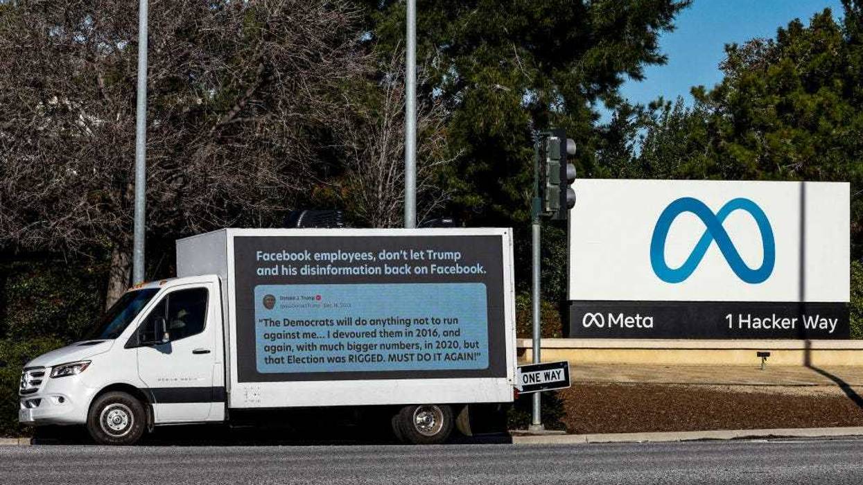 A mobile billboard, deployed by Accountable Tech, is seen outside the Meta Headquarter on January 17, 2023 in Menlo Park, California. Accountable Tech, an advocacy nonprofit, has deployed the mobile billboards as Meta considers reinstating Donald Trump’s Facebook page after a two-year suspension since the Capital insurrection. The billboards highlight Trump’s recent posts on Truth Social as a reason against reinstatement. (Photo by Kimberly White/Getty Images for Accountable Tech)