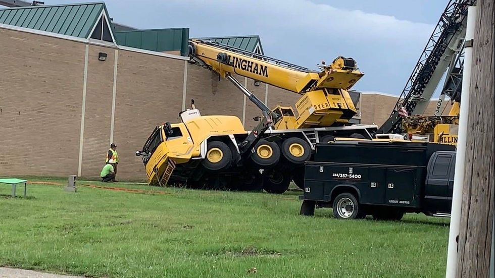 A mobile construction crane appears to have fallen into a middle school in the City of Wayne early Thursday afternoon.