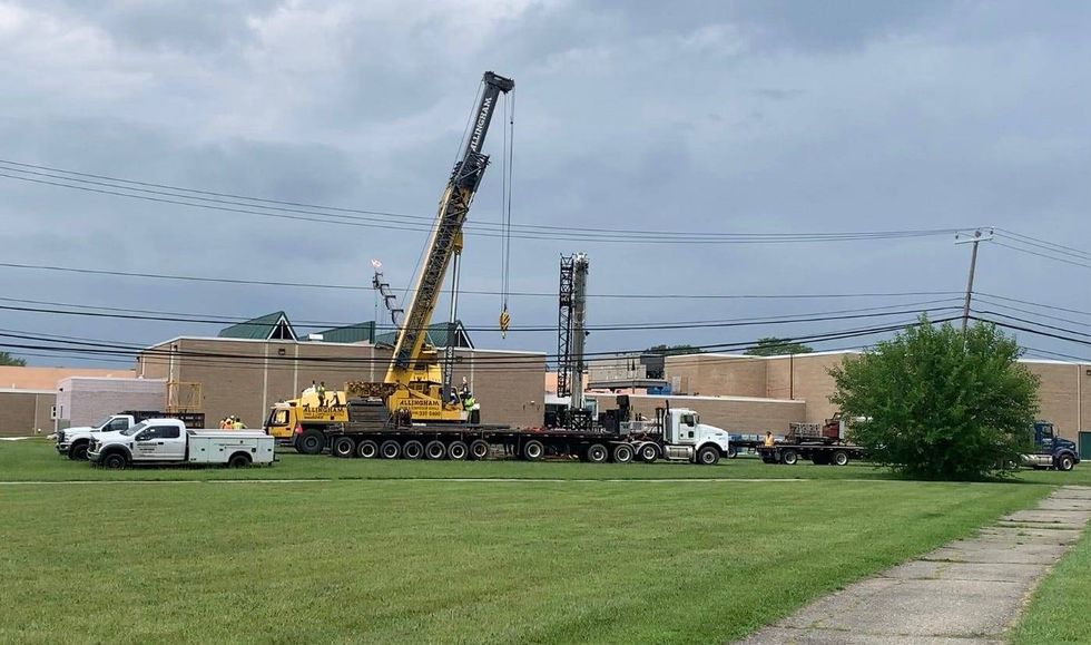 A mobile construction crane appears to have fallen into a middle school in the City of Wayne early Thursday afternoon.