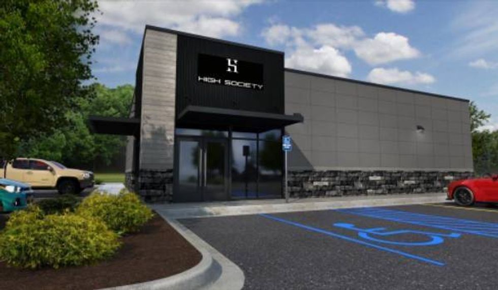 A modern building, featuring thin wood paneling, sleek black signage over a black awning and a wall of large rectangular tiling. The foundation is mixed brick.