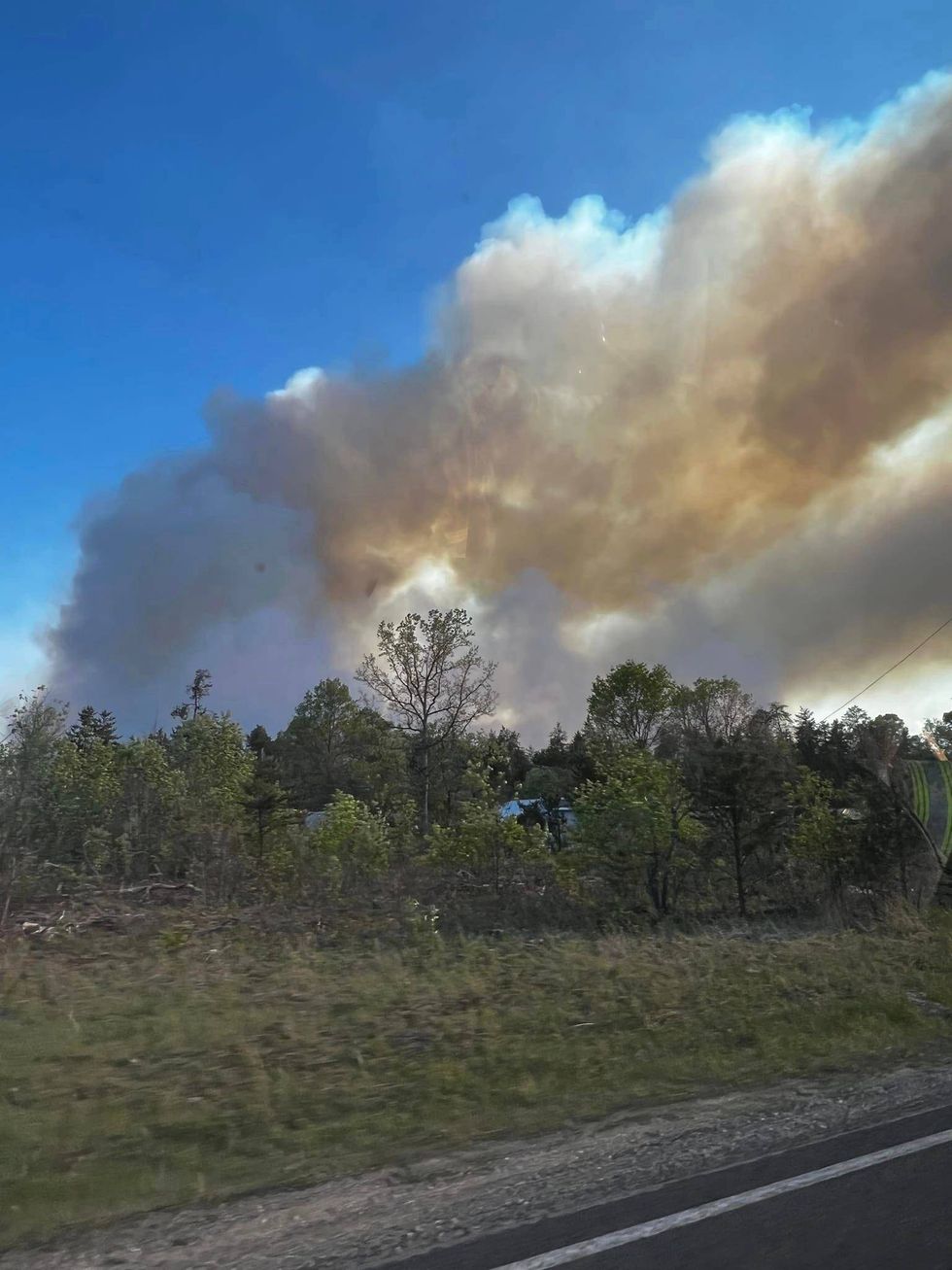 A modest campfire quickly spread into a full-scale wildfire on Friday, burning through 160 acres before crews got it under control in Northern Michigan.
