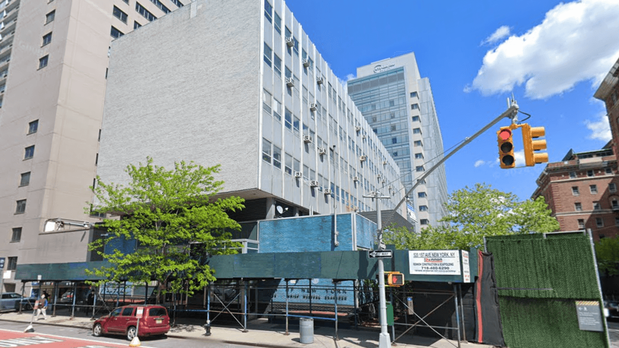 A more than 15-year-old sidewalk shed outside an Office of the Chief Medical Examiner building at 520 First Ave. has been removed