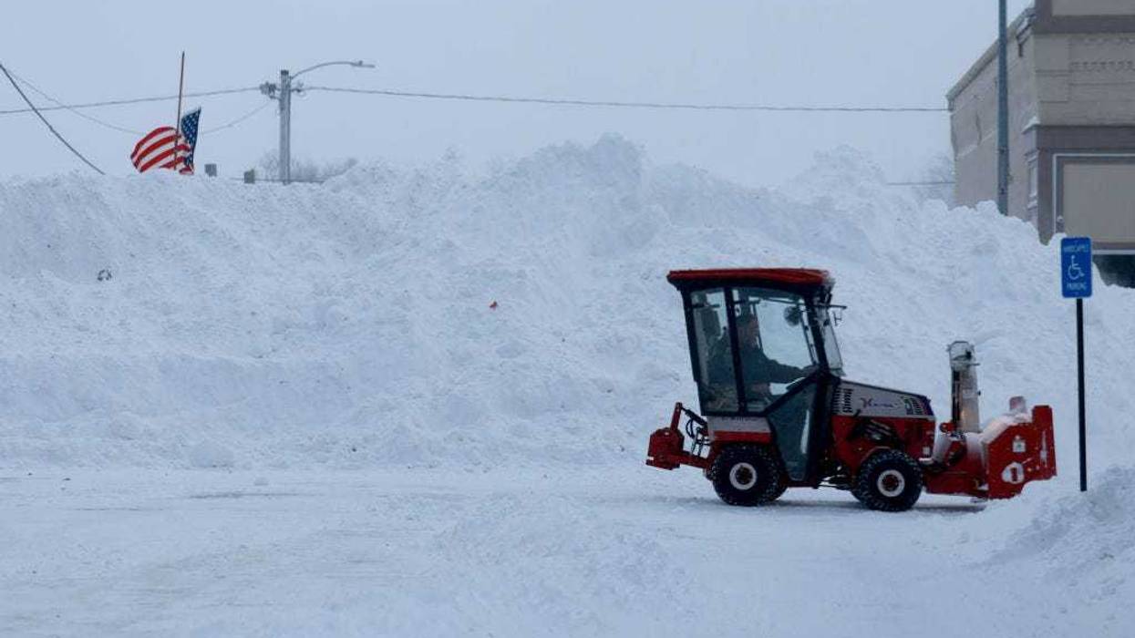 A mound of snow sits in the main street as a snowy and freezing cold weather system passes through the area on January 13, 2024, in Adair, Iowa.