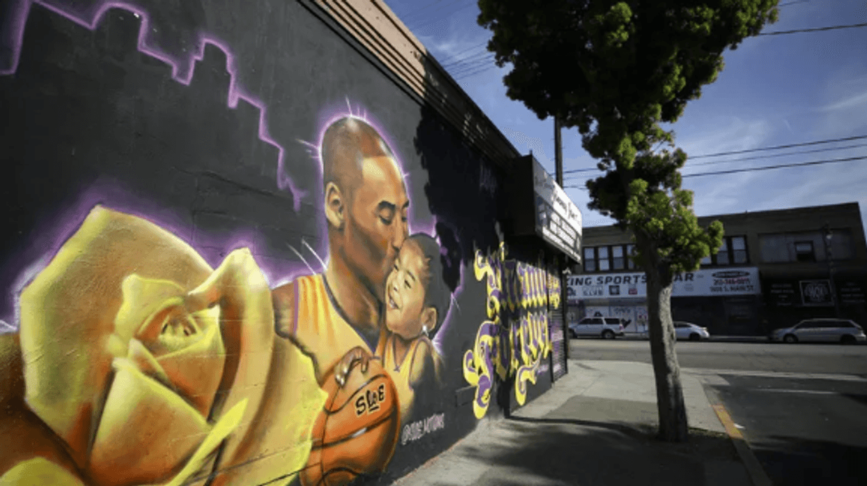 A mural depicting deceased NBA star Kobe Bryant and his daughter Gianna, painted by @sloe_motions, is displayed on a building on February 13, 2020 in Los Angeles, California..