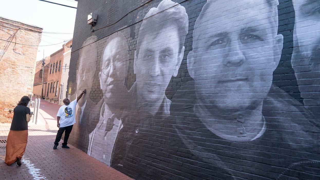 A mural honoring 18 wrongfully detained Americans was unveiled in Washington DC on July 20, 2022. At far right is Paul Whelan.