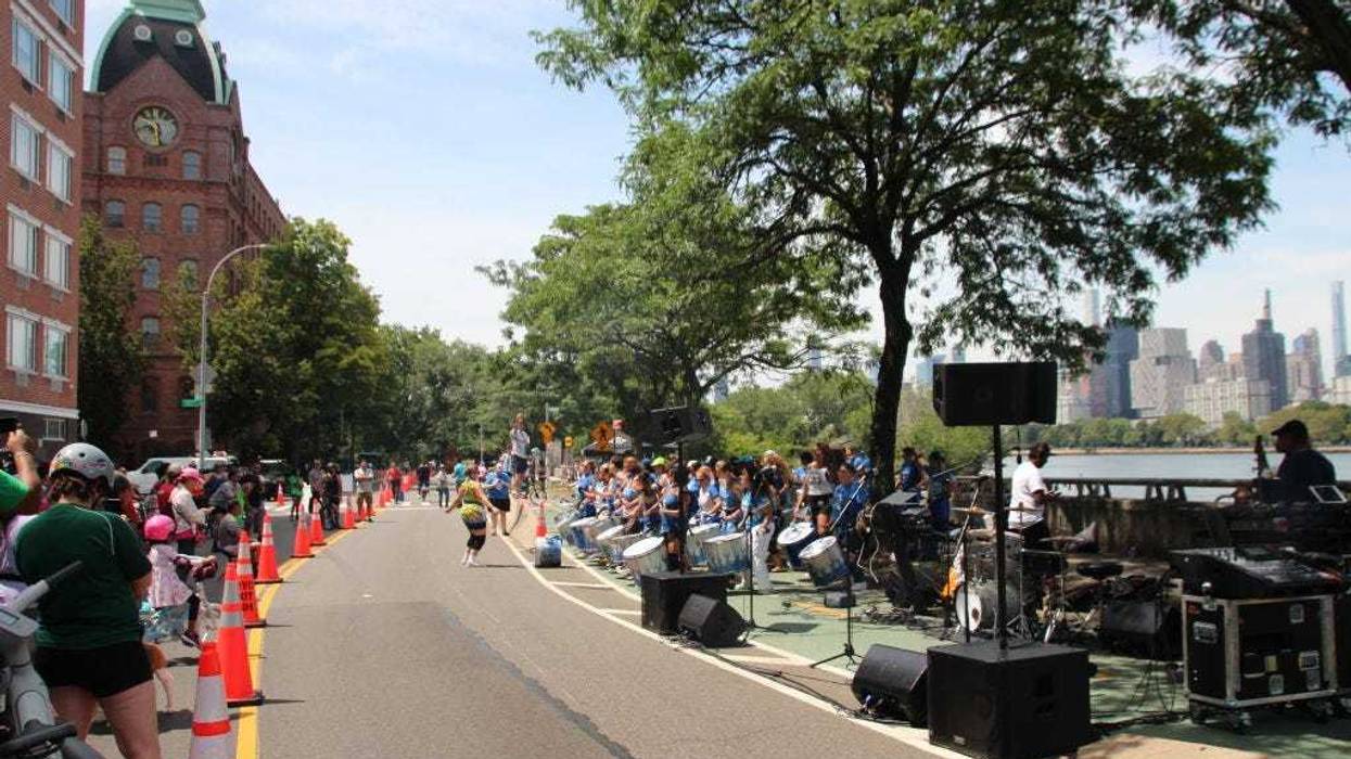 A music group plays on a temporarily car-free street in the New York borough of Queens on July 29, 2023.