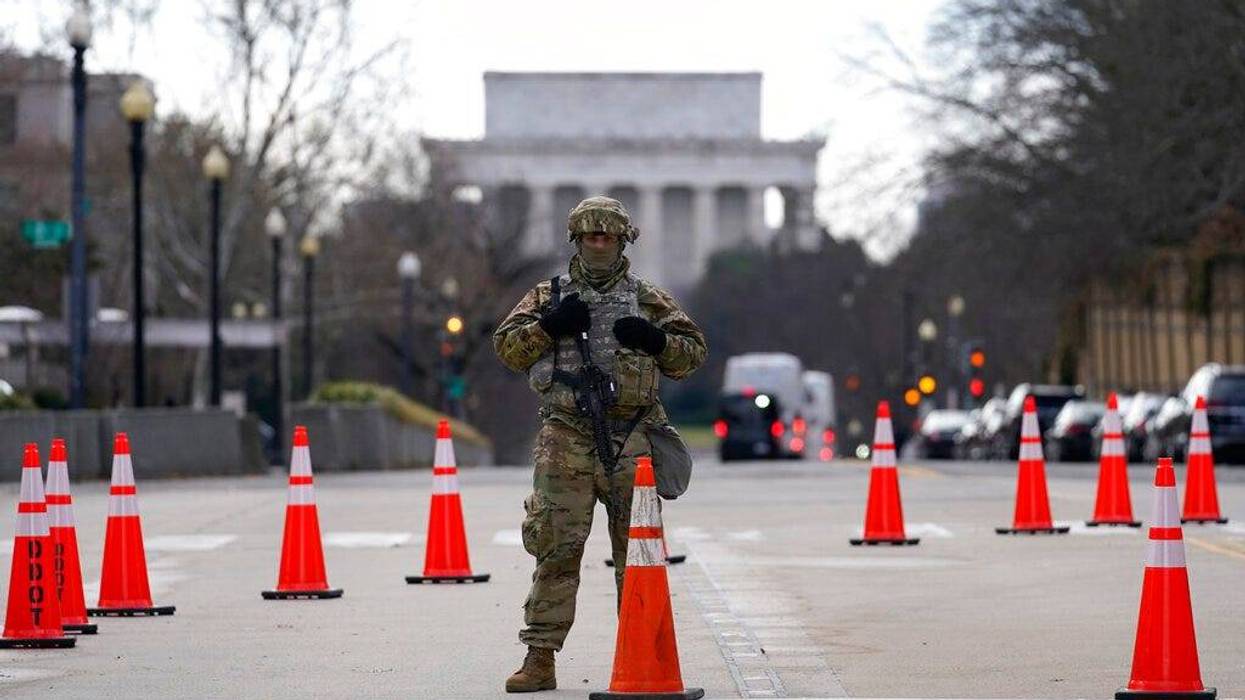 A National Guard stands at a road block near the Supreme Court ahead of President-elect Joe Biden's inauguration ceremony, Wednesday, Jan. 20, 2021, in Washington. (AP Photo/Gerald Herbert)
