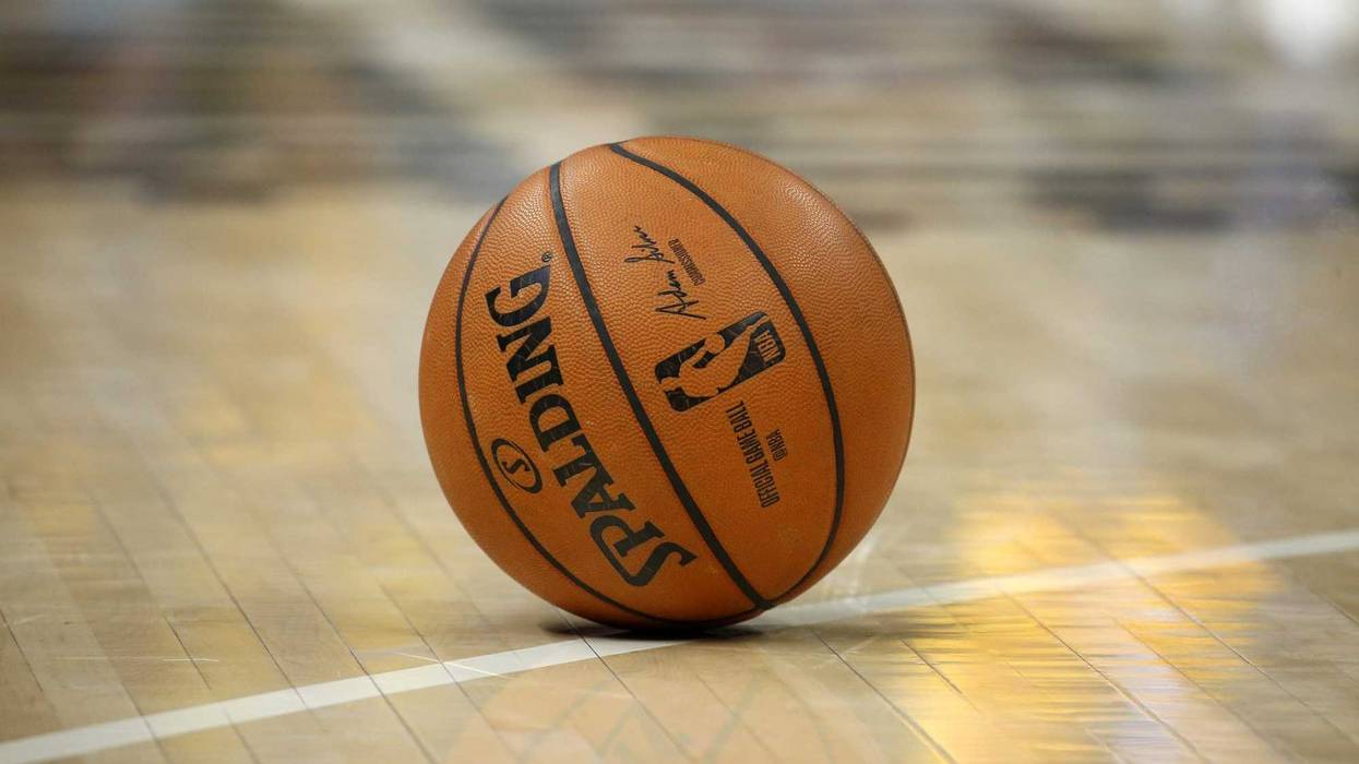 A NBA basketball rests on the floor during a game between the Brooklyn Nets and the Indiana Pacers during the fourth quarter at Bankers Life Fieldhouse