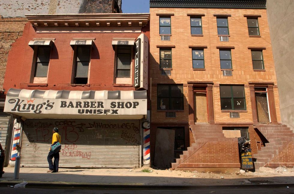 A new apartment building is under construction August 16, 2001 in Harlem, New York City. A small but vocal community in Harlem is upset at the Upper Manhattan Empowerment Zone (UMEZ), claiming that the historically black community