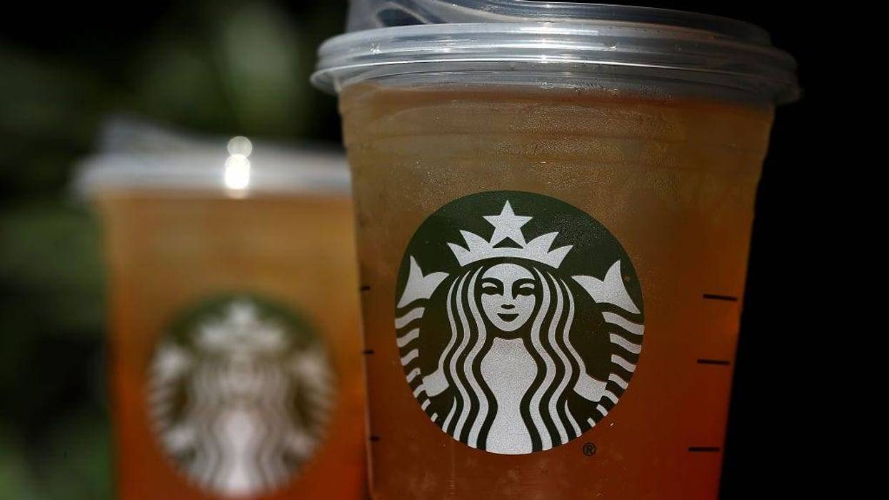A new flat plastic lid that does not need a straw is shown on a cup of Starbucks iced tea on July 9, 2018 in Sausalito, California.