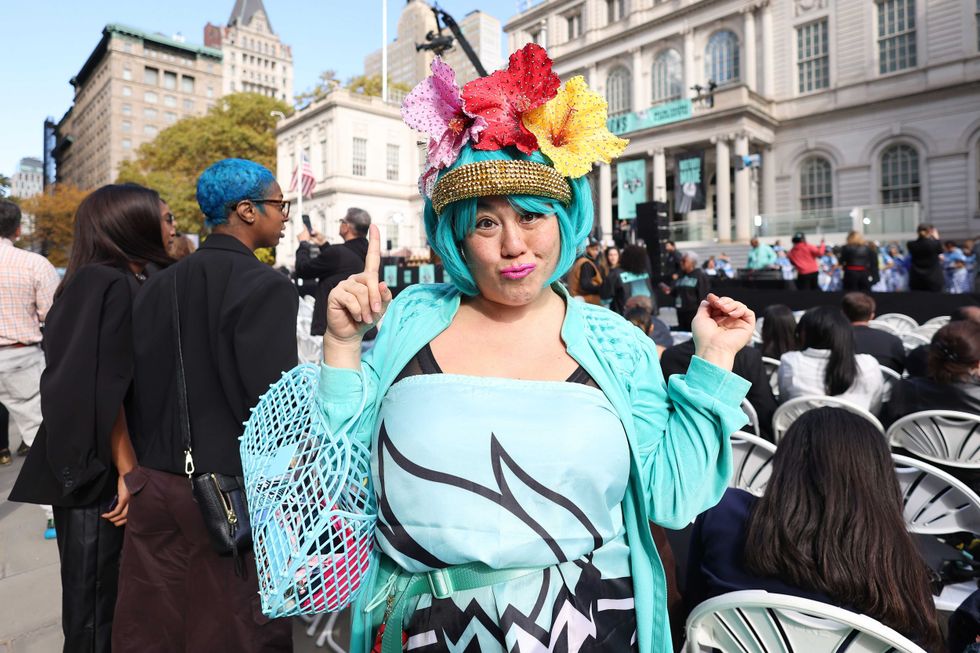 A New York Liberty fan poses during the Championship ticker tape parade and victory rally celebrating winning the 2024 WNBA Finals at City Hall on October 24, 2024 in New York City