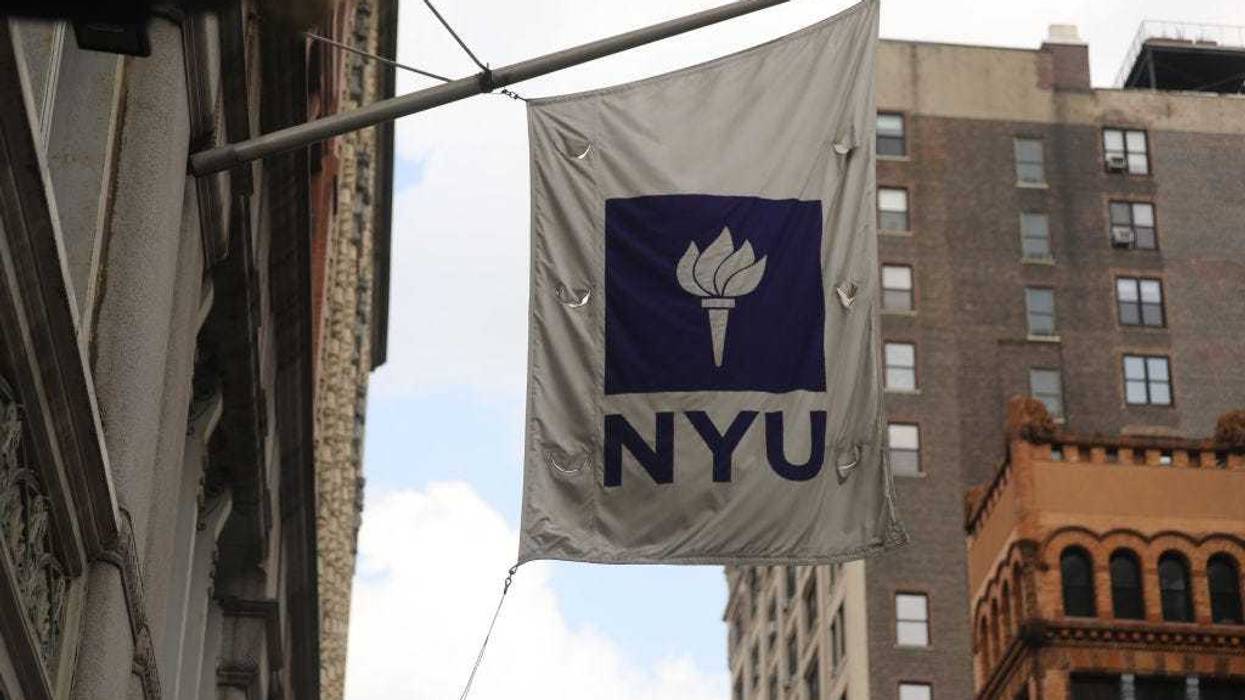 A New York University (NYU) flag flies outside the NYU business school on August 25, 2020, in New York City.
