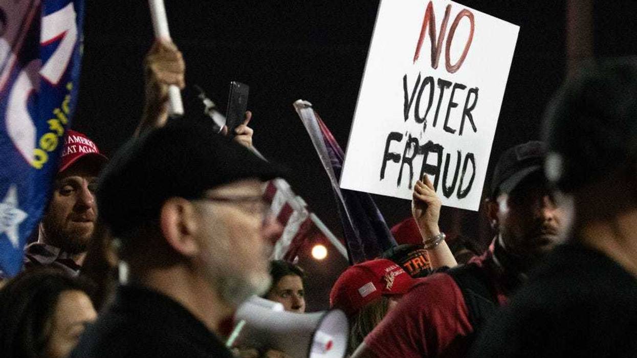 A no voter fraud sign is displayed by a protester in support of President Donald Trump at the Maricopa County Elections Department office on November 4, 2020 in Phoenix, Arizona. The rally was organized after yesterday's vote narrowly turned for Democrats in the presidential and senate races. (Photo by Courtney Pedroza/Getty Images)