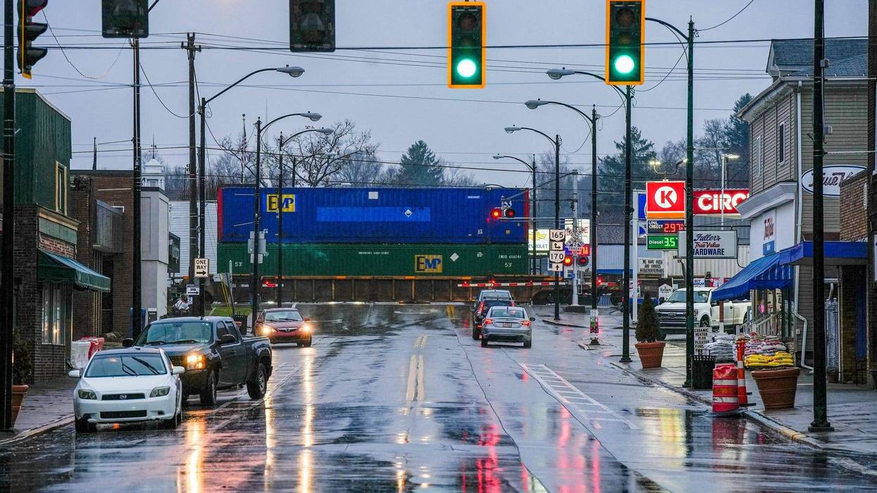 A Norfolk Southern train passes Market Street in downtown East Palestine on Wednesday, January 24, 2024