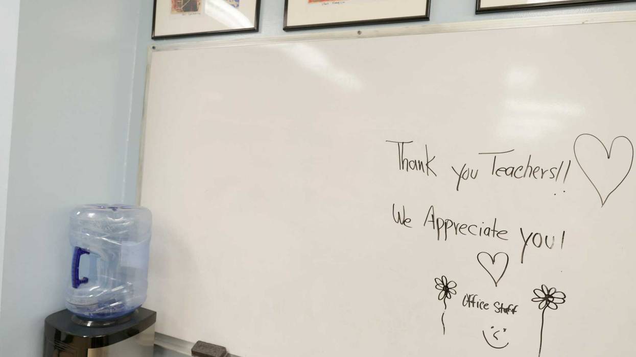 A note supporting teachers from the faculty is seen on a dry-erase board in the office at Sun Yat Sen M.S. 131 on May 05, 2021 in New York City.