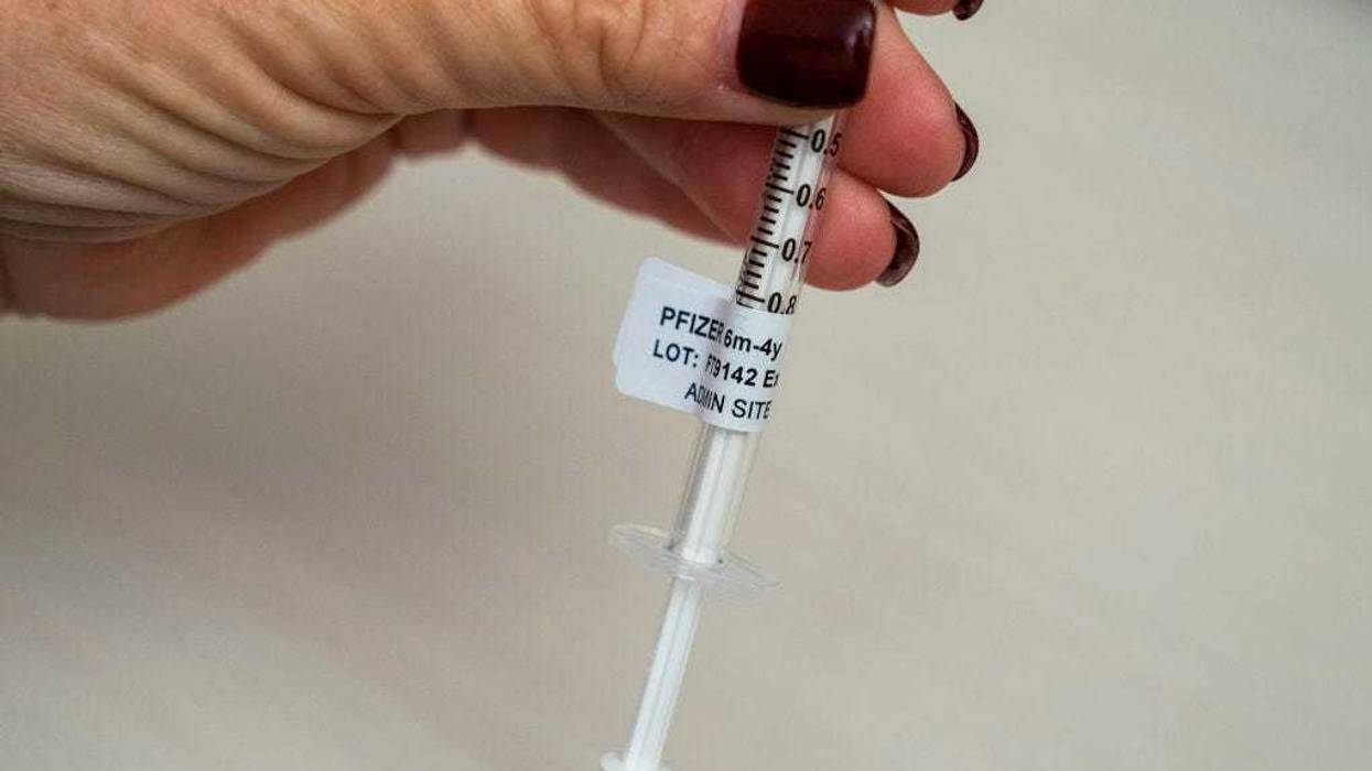 A nurse holds a syringe that contains a dose of the Pfizer Covid-19 vaccine for children under age five at UW Medical Center - Roosevelt on June 21, 2022 in Seattle, Washington. Covid-19 vaccinations for children younger than 5 began today across the U.S. (Photo by David Ryder/Getty Images)
