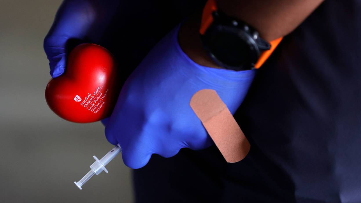 A nurse with Stanford Children's Health holds a syringe and a stress ball before delivering a Pfizer COVID-19 vaccination at a drive-thru vaccine clinic on May 13, 2021 in San Jose, California.
