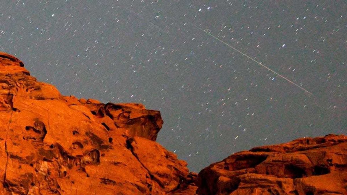 A pair of Perseid meteors streak over a sandstone outcropping at Redstone in the Pinto Valley wilderness area on August 12, 2021 in the Lake Mead National Recreation Area, Nevada.