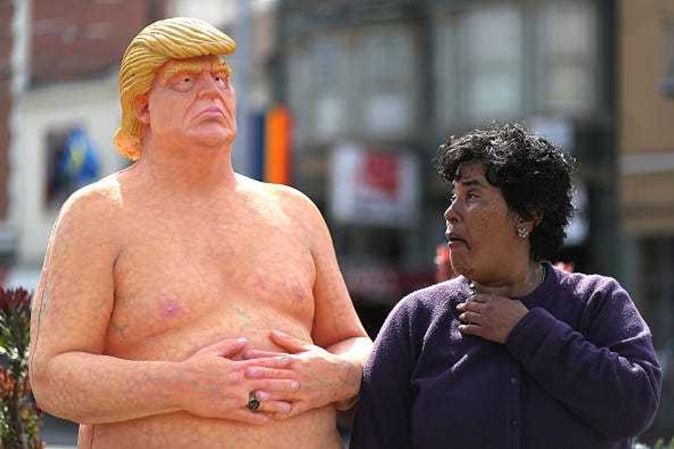 A passerby looks at a statue depicting republican presidential nominee Donald Trump in the nude on August 18, 2016 in San Francisco, United States. Anarchist collective INDECLINE has created five statues depicting Donald Trump in the nude and placed them in five U.S. cities on Thursday morning. The statues are in San Francisco, New York, Los Angeles, Cleveland and Seattle. (Photo by Justin Sullivan/Getty Images