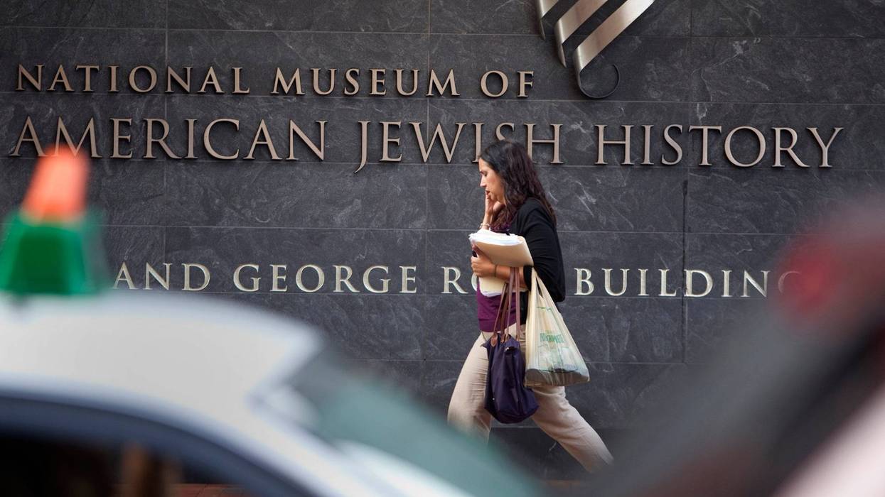A passerby walks in front of the American Jewish History Museum.