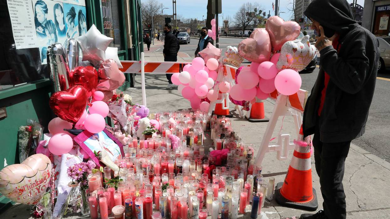 A pedestrian looks at the memorial for 16-year-old Kayla Green on April 11, 2022, in Mount Vernon.