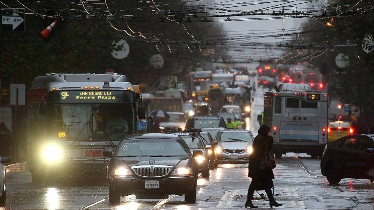 A pedestrian walks in the rain on December 11, 2014 in San Francisco, California.