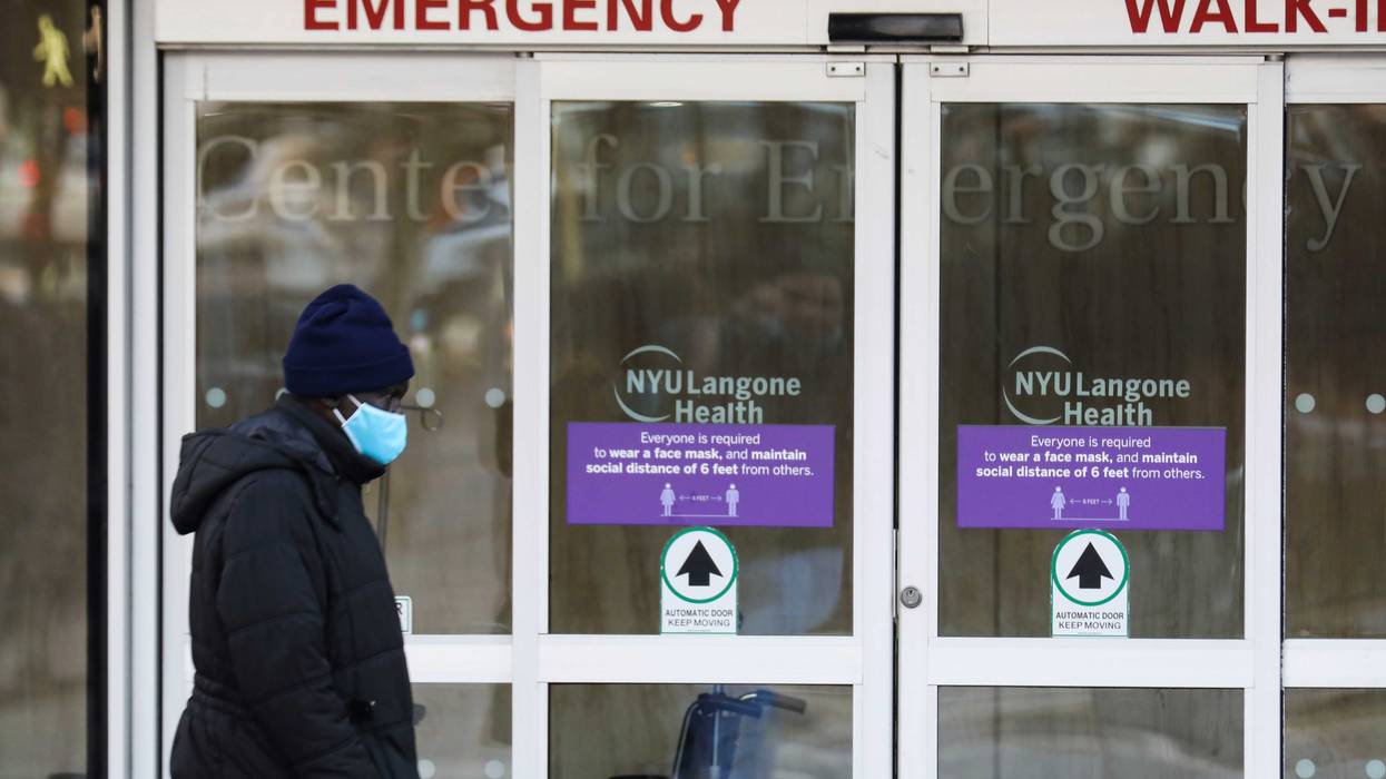 A pedestrian walks past the entrance of an emergency room of a hospital in New York City on Dec. 13, 2021