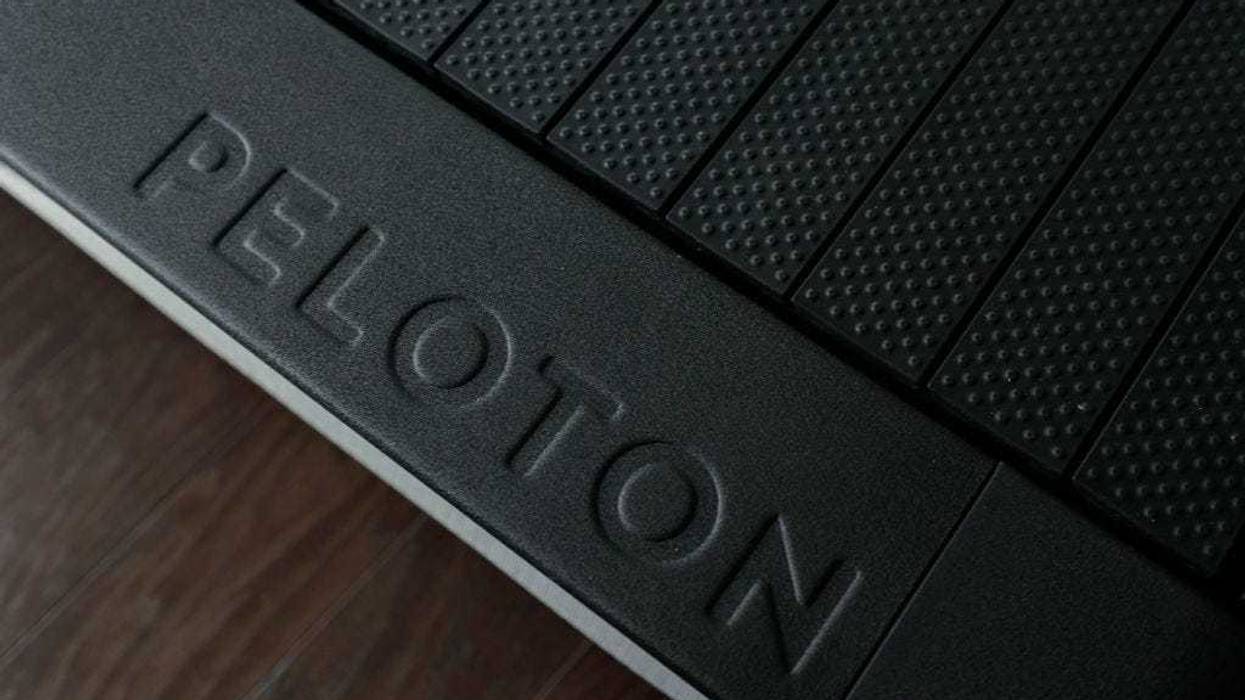 A Peloton Tread+ treadmill (logo detail) is stationed in a living room on May 24, 2021 in Williamstown, New Jersey.