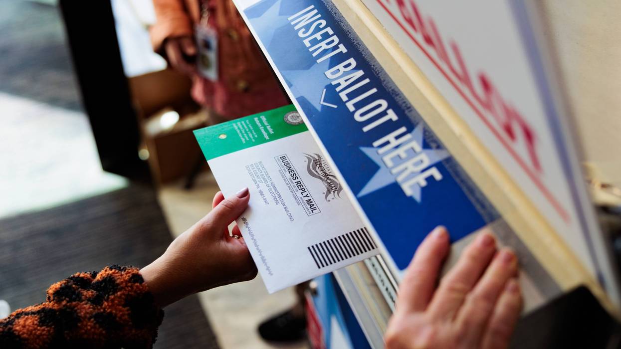 A person drops off a mail-in ballot on October 15, 2024, in Doylestown, Pennsylvania.