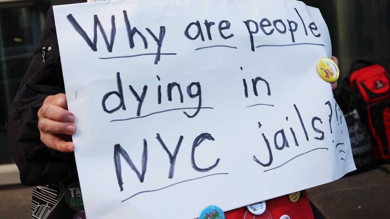 A person holds a sign during a rally outside the NYC office of Gov. Kathy Hochul on March 21, 2022 in New York City. Prison activists gathered outside of the NYC office of Gov. Kathy Hochul to bring attention to the conditions at Rikers Island following the death of a detainee on Friday while in custody in the jail. The death was the second last week and the third death at the jail complex so far this year. The activists called on Gov. Hochul to close the jail and invest in alternative options to incarceration.