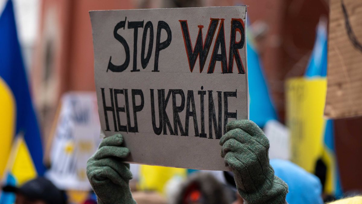 A person holds a sign that reads "Stop War Help Ukraine" during a "Stand With Ukraine" rally at the Russian Mission on February 24, 2022 in New York City.
