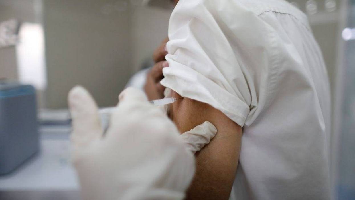 A person is vaccinated during a national campaign of vaccination implemented by the government after having decreed a state of health emergency at CDI Dr. Alcides Rodriguez on March 14, 2020 in Caracas, Venezuela.