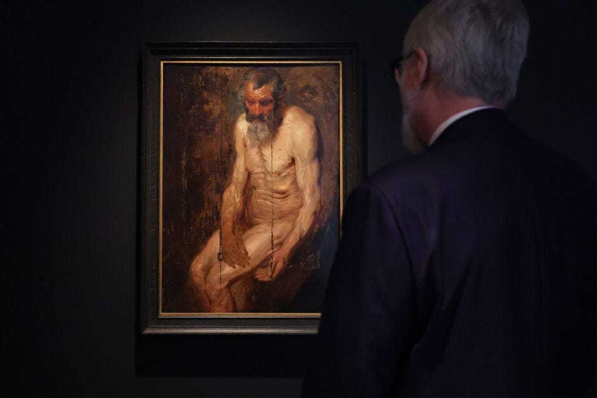 A person looks at Sir Anthony van Dyck's "A study for Saint Jerome" during the Masters Week press preview at Sotheby's New York on January 20, 2023 in New York.