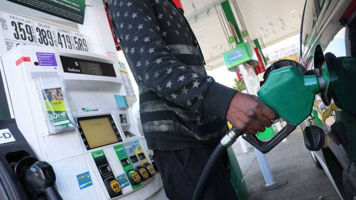 A person prepares to pump gas at a BP gas station on Coney Island Avenue on October 19, 2022 in the Flatbush neighborhood of Brooklyn borough in New York City.