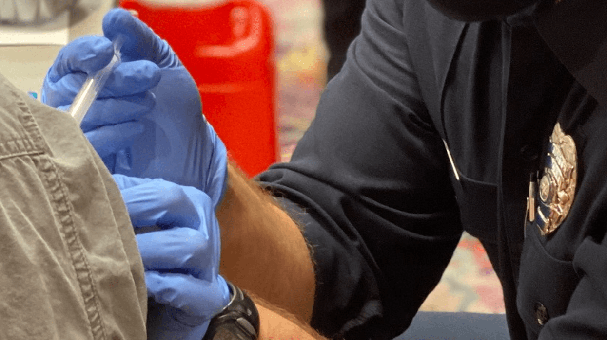 A person receives their coronavirus vaccination