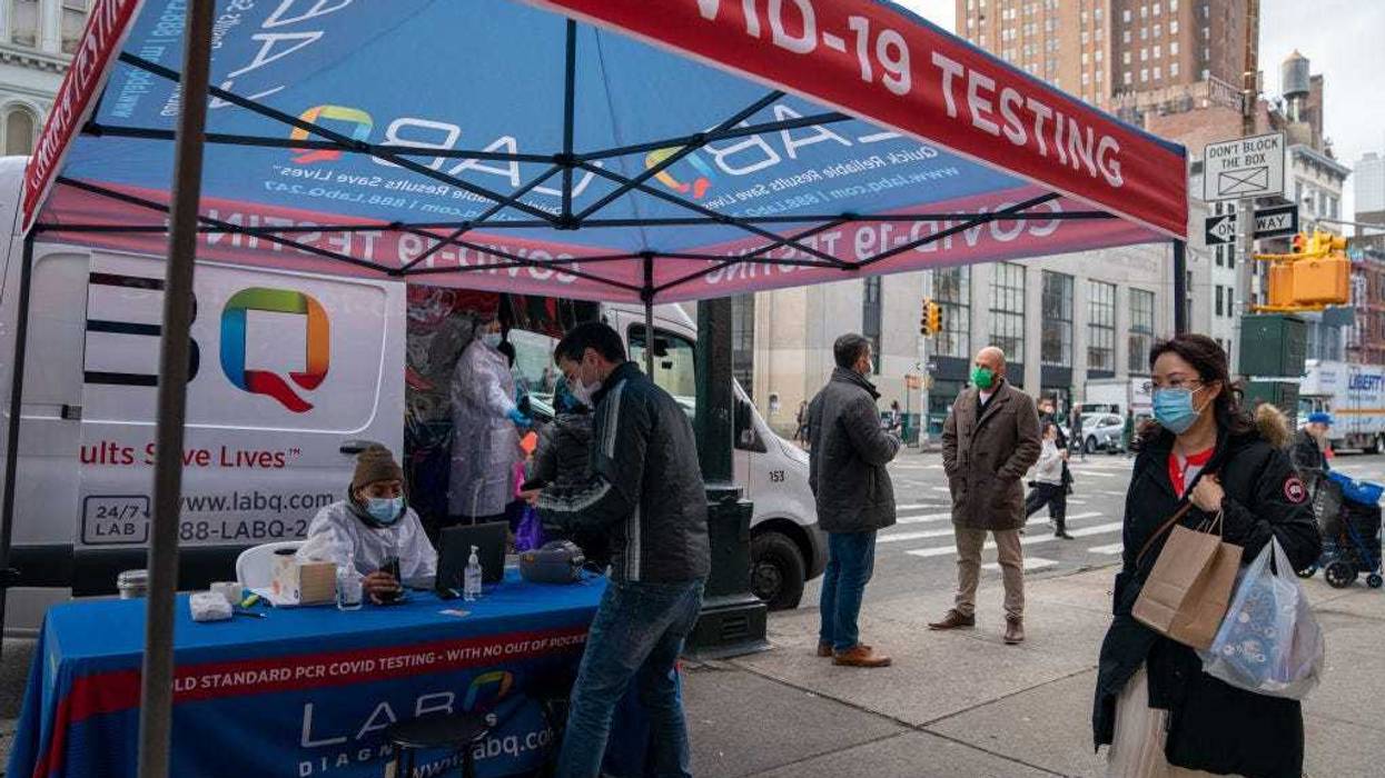 A person registers to have a COVID-19 test administered at a walk up testing site on December 15, 2021 in New York City. The Centers for Disease Control and Prevention says the New York is one of two states with the highest spread of the Omicron COVID-19 variant the other being New Jersey. New York City is seeing a faster spread of Omicron, compared to the majority of the country, according to recently released CDC findings. (Photo by David Dee Delgado/Getty Images)