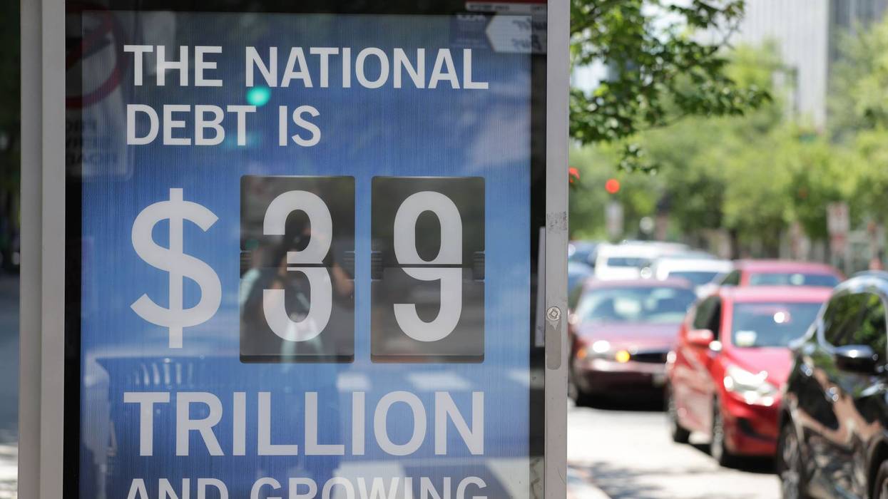 A Peterson Foundation bus stop sign displays the national debt on June 12, 2026 in Washington, DC.