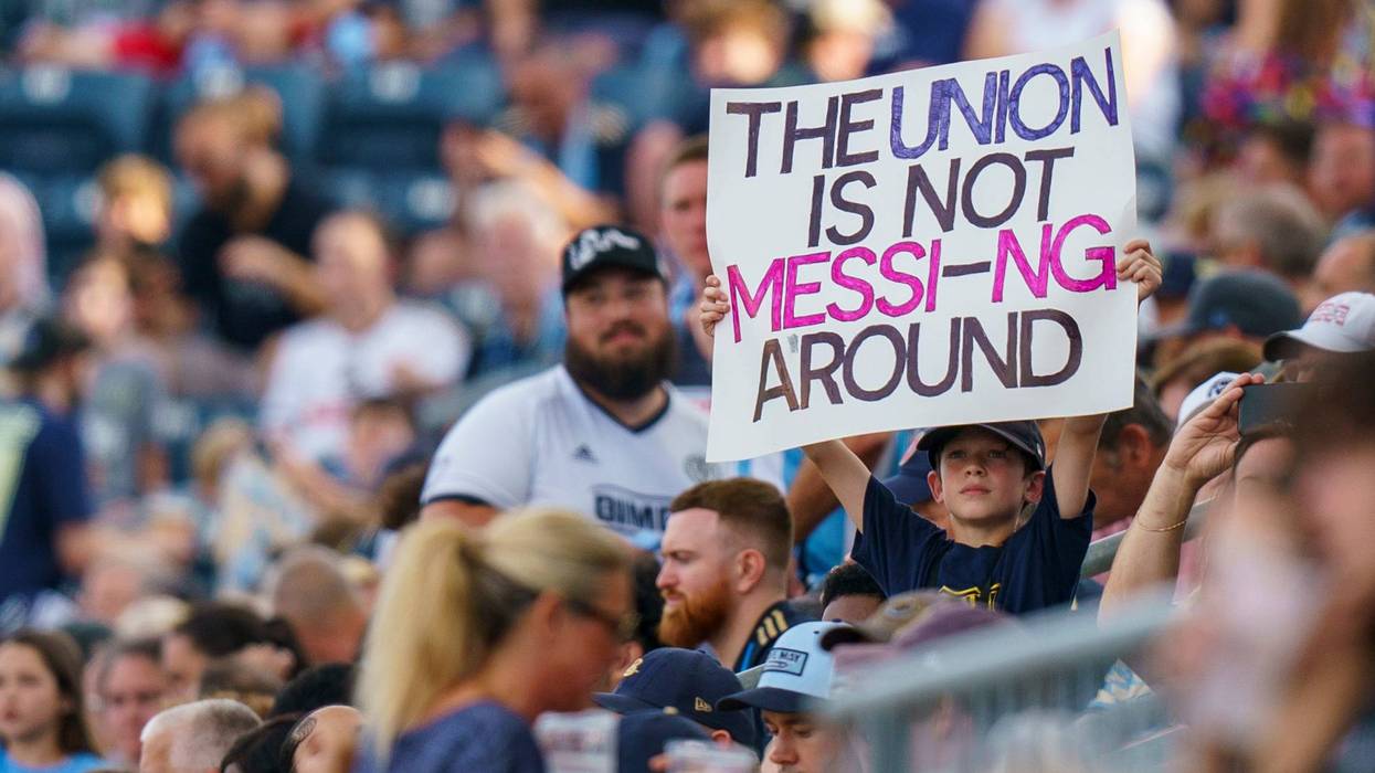 A Philadelphia Union fan holds up a sign about Inter Miami's Lionel Messi during the first half of a Leagues Cup soccer semifinal Tuesday, Aug. 15, 2023, in Chester, Pa.