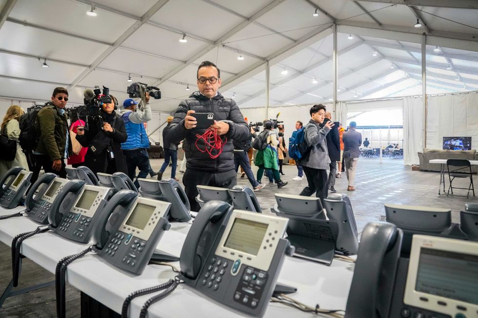 A phone bank center to make international calls, shown during a media tour, is part of New York City
