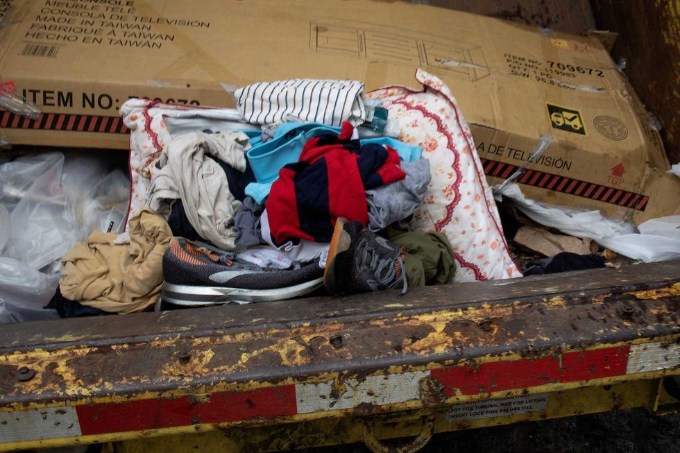 A photo of trashed clothes and a pillow after an encampment sweep on September 22, 2022.