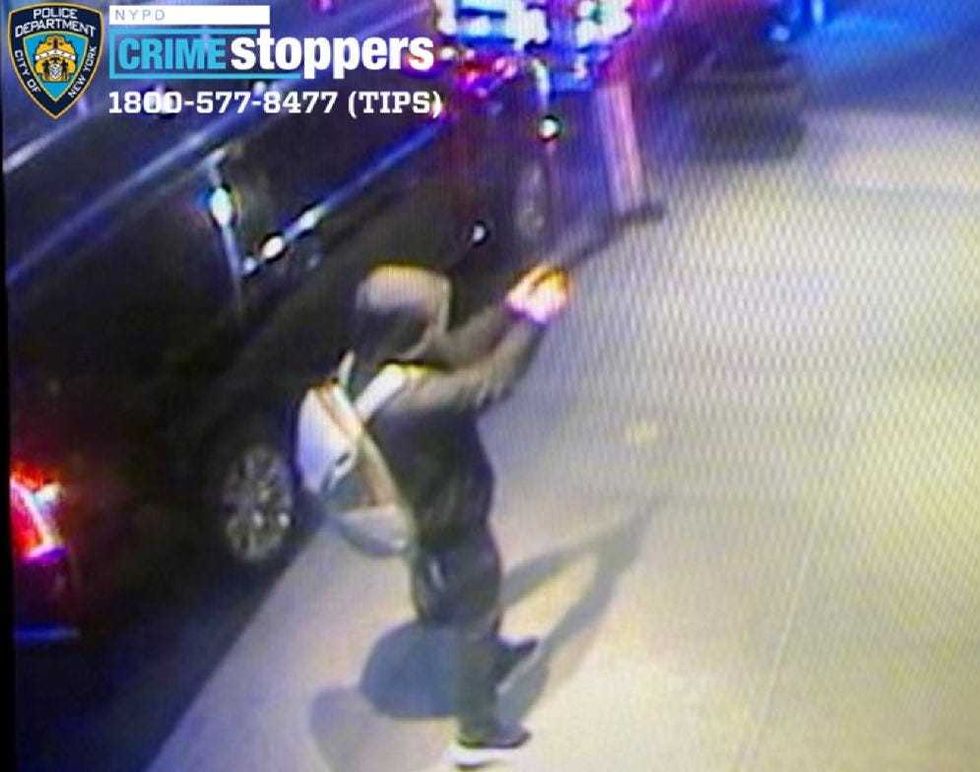 A photo shows the gunman opening fire on Thompson