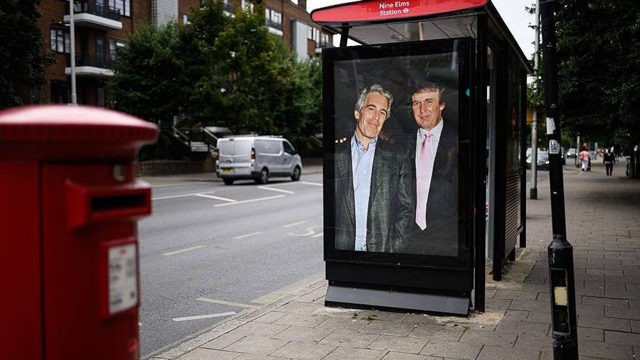 A photograph of US President Donald Trump and convicted child sex offender Jeffrey Epstein is displayed after being unofficially installed in a bus shelter on July 17 in London, England.