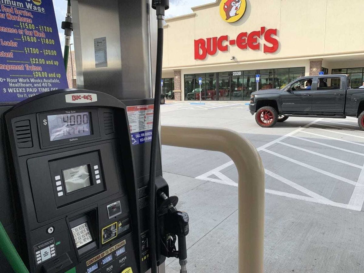 A pickup truck drives by the fueling area at the 104-pump Buc-ee's gas station/travel convenience center next to the Interstate 95/LPGA Boulevard interchange in Daytona Beach on Monday afternoon, May 10, 2021.
