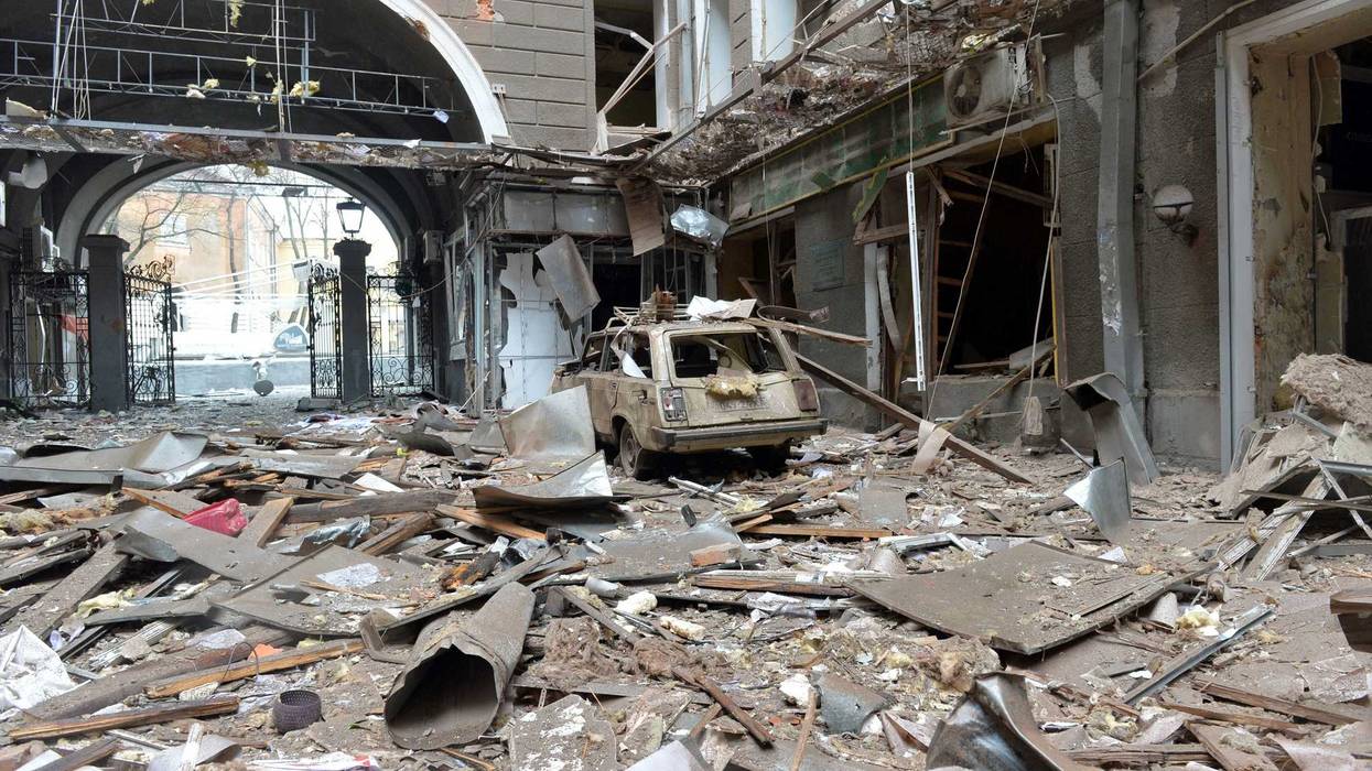 A picture shows damages in a building entrance after the shelling by Russian forces of Constitution Square in Kharkiv, Ukraine's second-biggest city, on March 2, 2022.