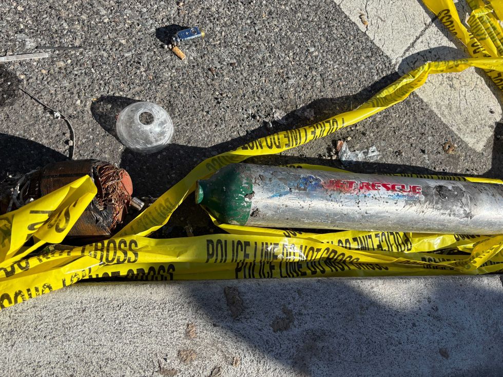 A piece from the plane seen on Cottman Avenue, about a half-mile away from the crash site.