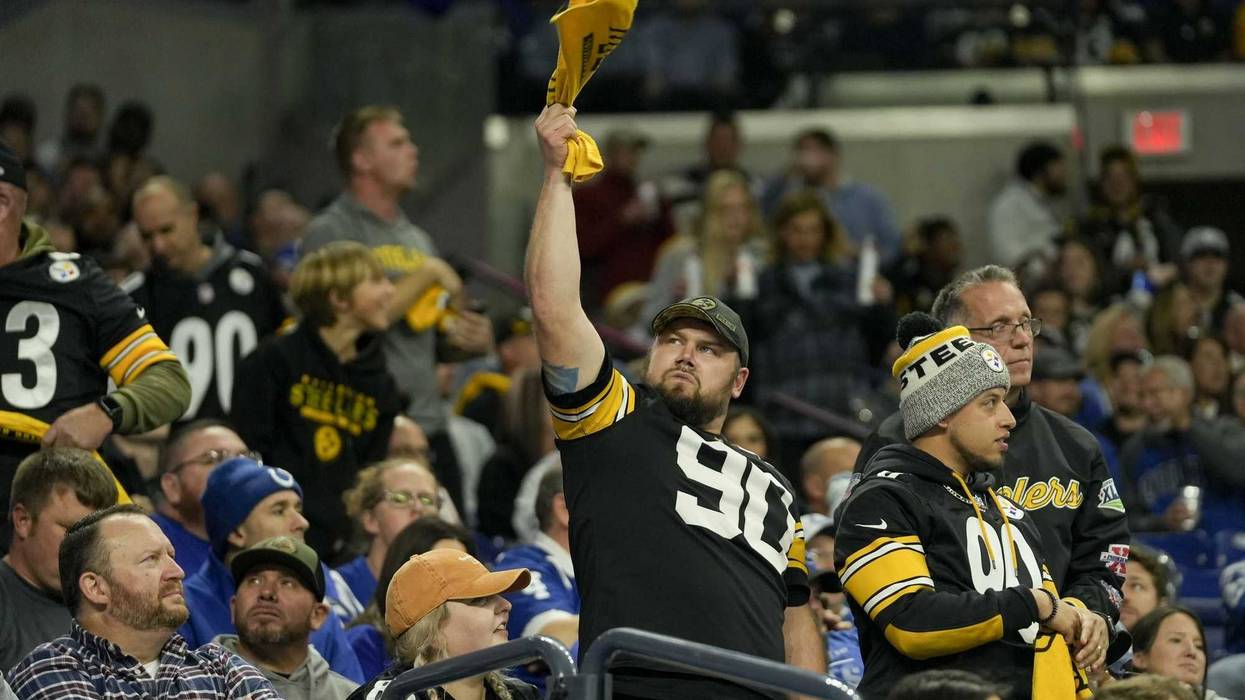 A Pittsburgh Steelers fan waves a towel in the stands during the first half against the Indianapolis Colts